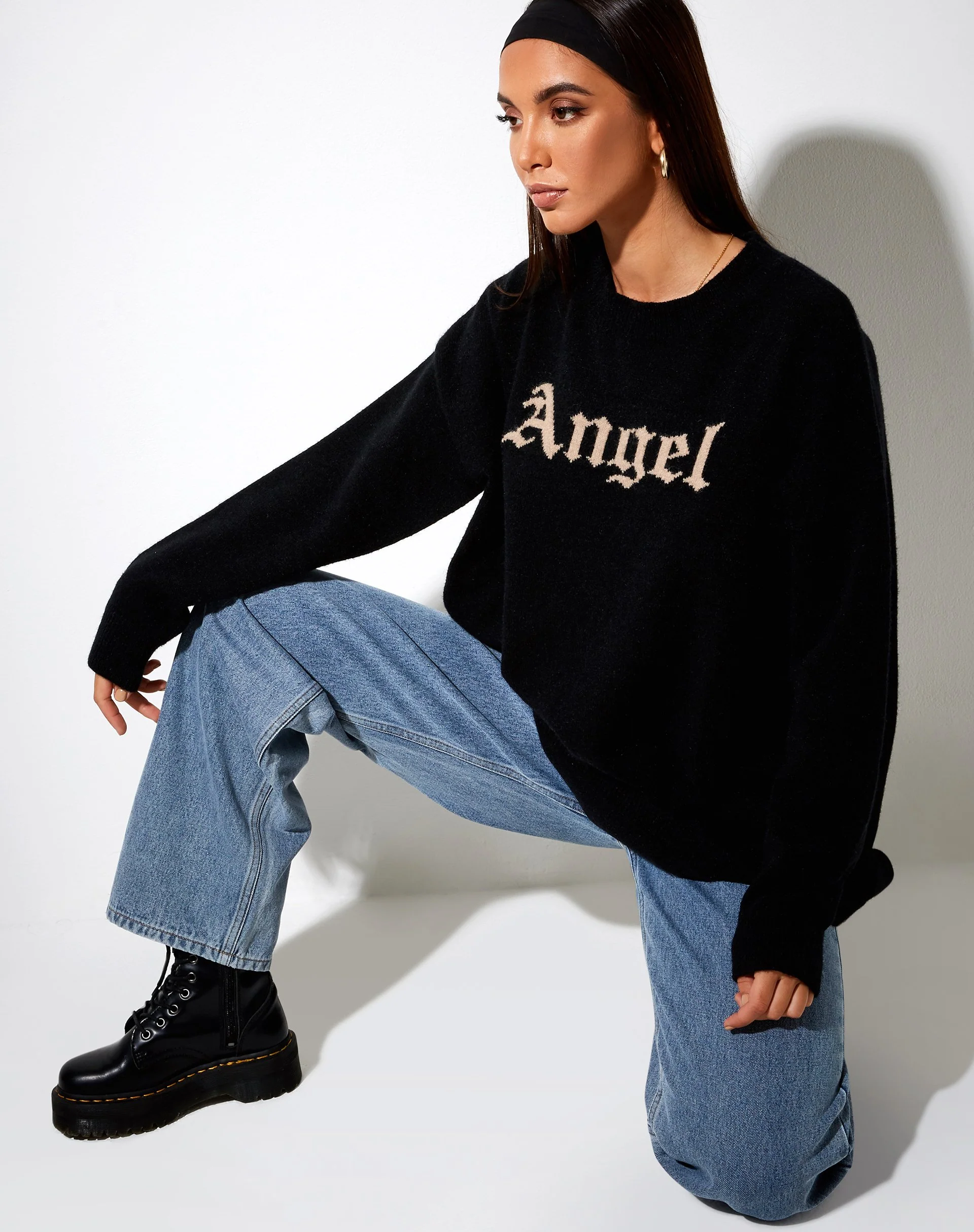 Lulees Pullover aus schwarzem Strick mit 'Angel' in Creme