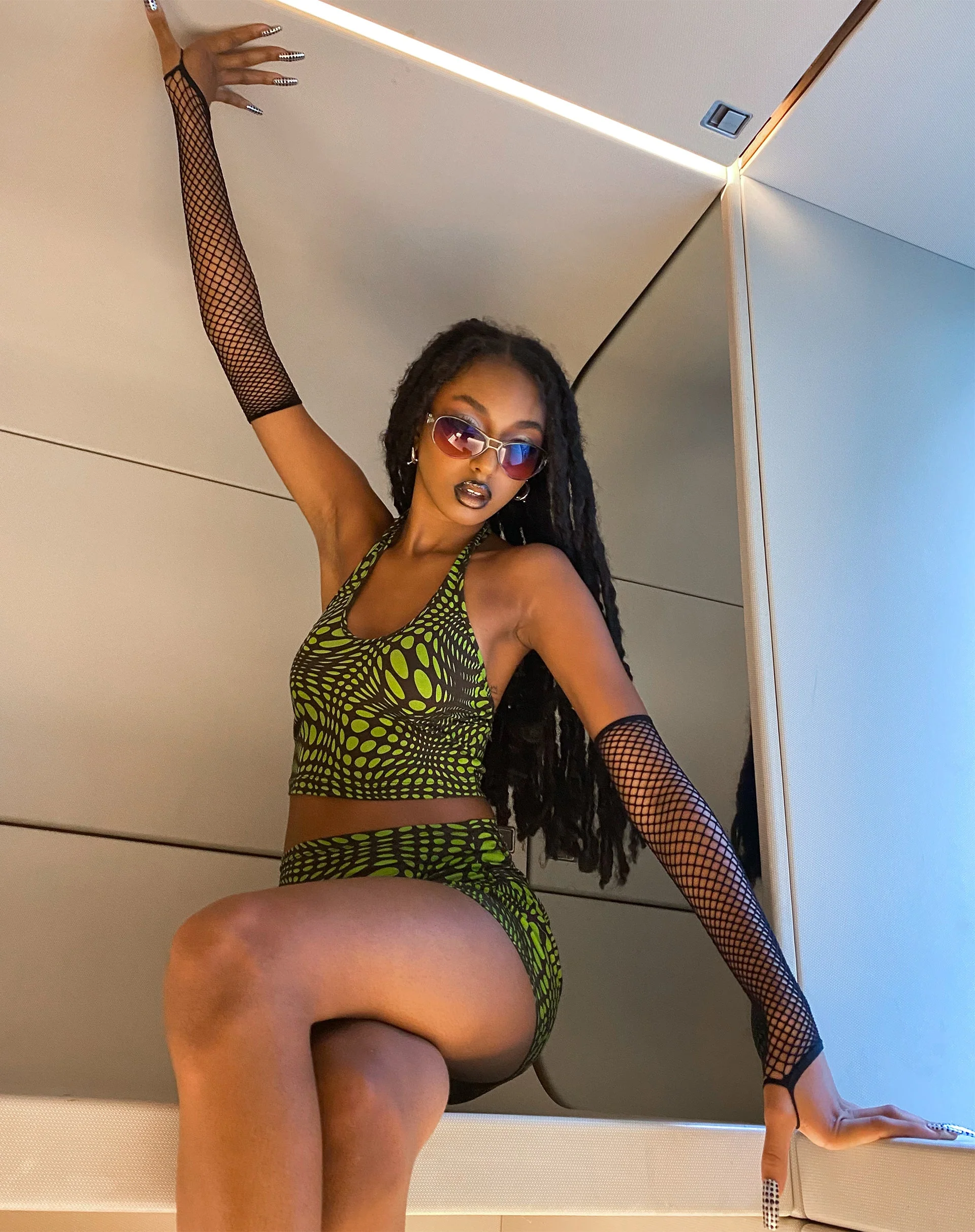 Reis Crop Top in Polka-Optik Grün